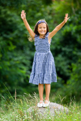 Girl standing on a stone "hand...